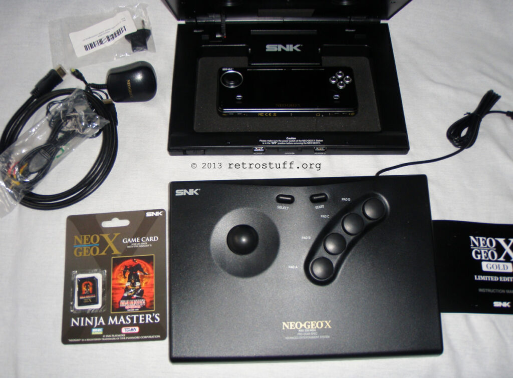 Neo Geo X handheld lying in docking station
